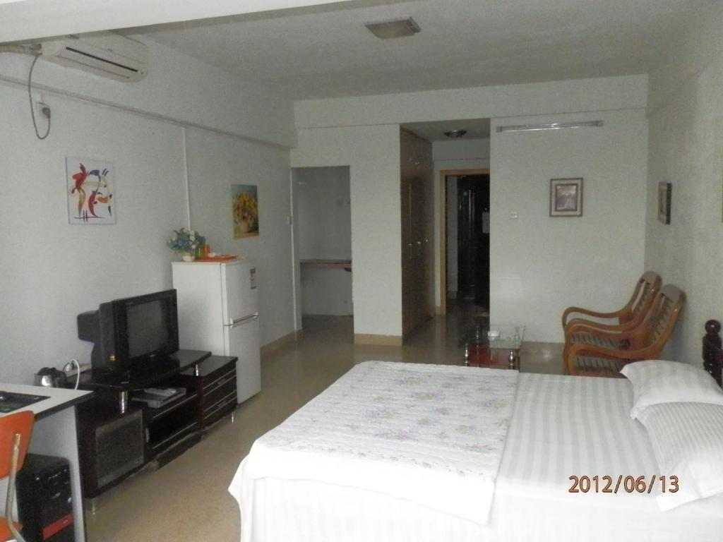 Xingfu Hotel Nanning Quarto foto