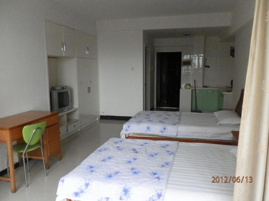 Xingfu Hotel Nanning Quarto foto